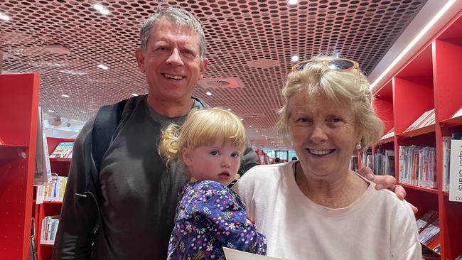 Peter and Merrian Penn with their granddaughter Heidi, 21 months, have immediately fallen in love with Parramatta's new library, Phive.