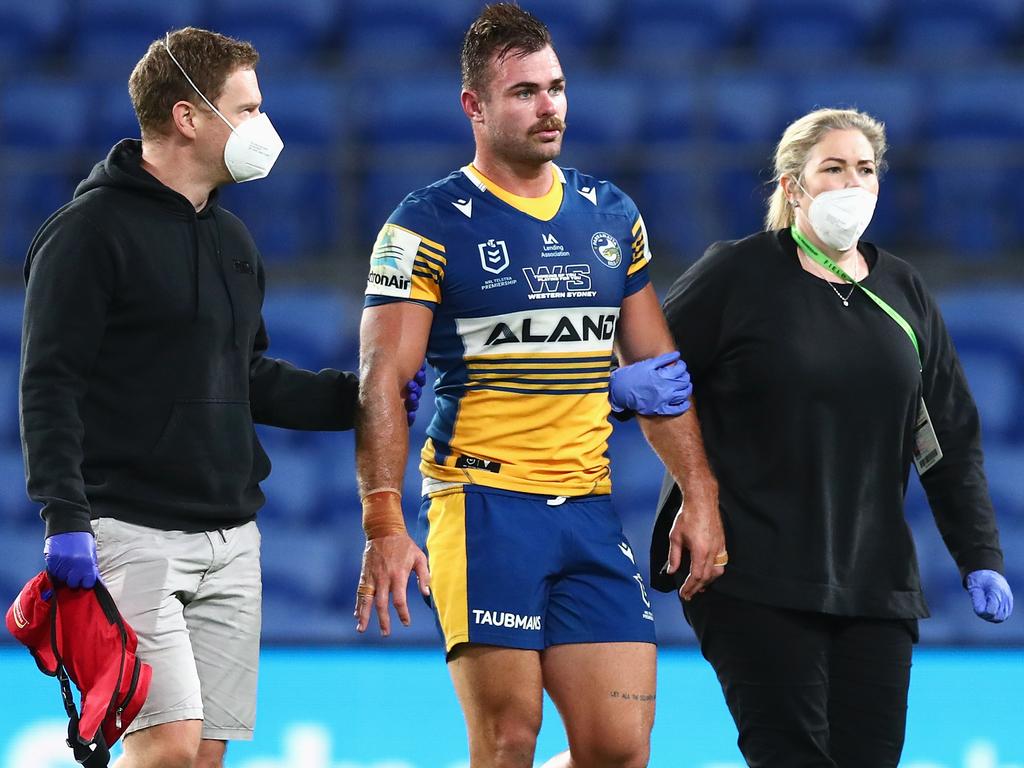 Keegan Hipgrave is assisted from the field in his final NRL game: Parramatta Eels vs Penrith Panthers in round 25 last season on the Gold Coast. Picture: Chris Hyde/Getty Images