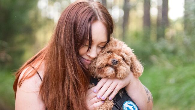 Autistic, disabled, Sunshine Coast woman, Grace Garrahy, says service dog saved her from suicide. Picture - contributed.