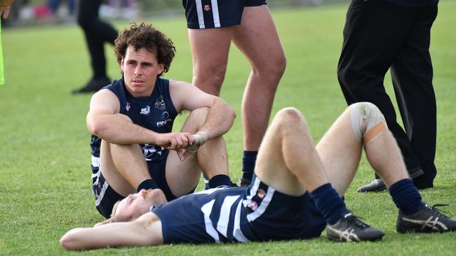 Deflated Noarlunga players after the final siren of the 2019 SFL grand final. Picture: AAP/Keryn Stevens