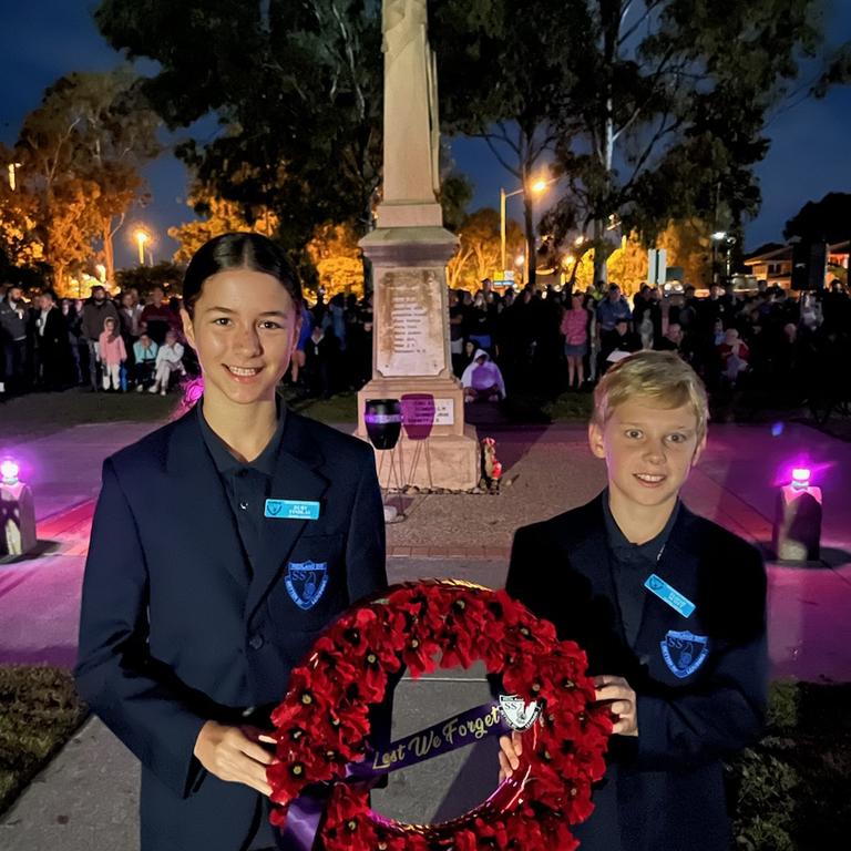 Redland Bay State School captains Ruby Findlay and Elijah Scott at the 109th anniversary of Anzac Day at Redland Bay cenotaph.