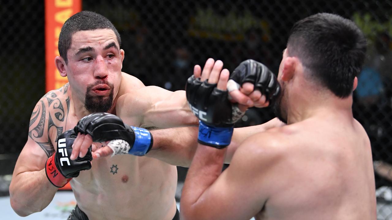 Robert Whittaker of Australia punches Kelvin Gastelum.