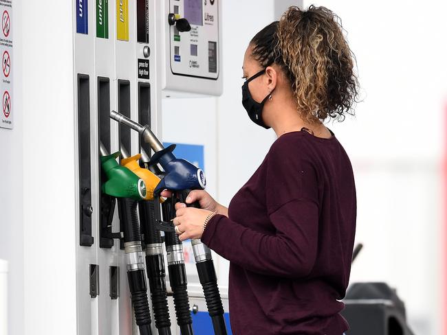 BRISBANE, AUSTRALIA - NewsWire Photos - AUGUST 10, 2021., A woman fills up her car at a service station in Woolloongabba, Brisbane. Despite a drop in oil prices unleaded fuel remains high across the country's capital cities at $1.73 a litre in Brisbane, $1.63 in Adelaide, $1.55 in Melbourne and $1.45 in Sydney., Picture: NCA NewsWire / Dan Peled