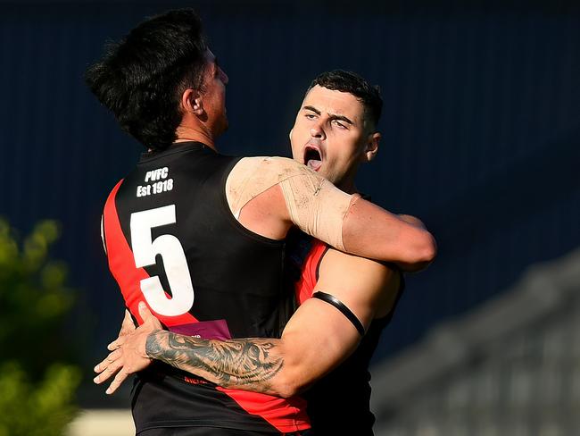 Paul Ahern of Pascoe Vale is congratulated by team mates after kicking a goal during the round two Strathmore Community Bank Premier Division Seniors match between Pascoe Vale and Strathmore at Raeburn Reserve, on April 20, 2024, in Melbourne, Australia. (Photo by Josh Chadwick)