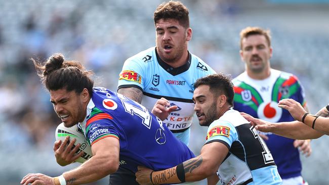 GOSFORD, AUSTRALIA - JULY 19: Tohu Harris of the Warriors is tackled during the round 10 NRL match between the New Zealand Warriors and the Cronulla Sharks at Central Coast Stadium on July 19, 2020 in Gosford, Australia. (Photo by Cameron Spencer/Getty Images)