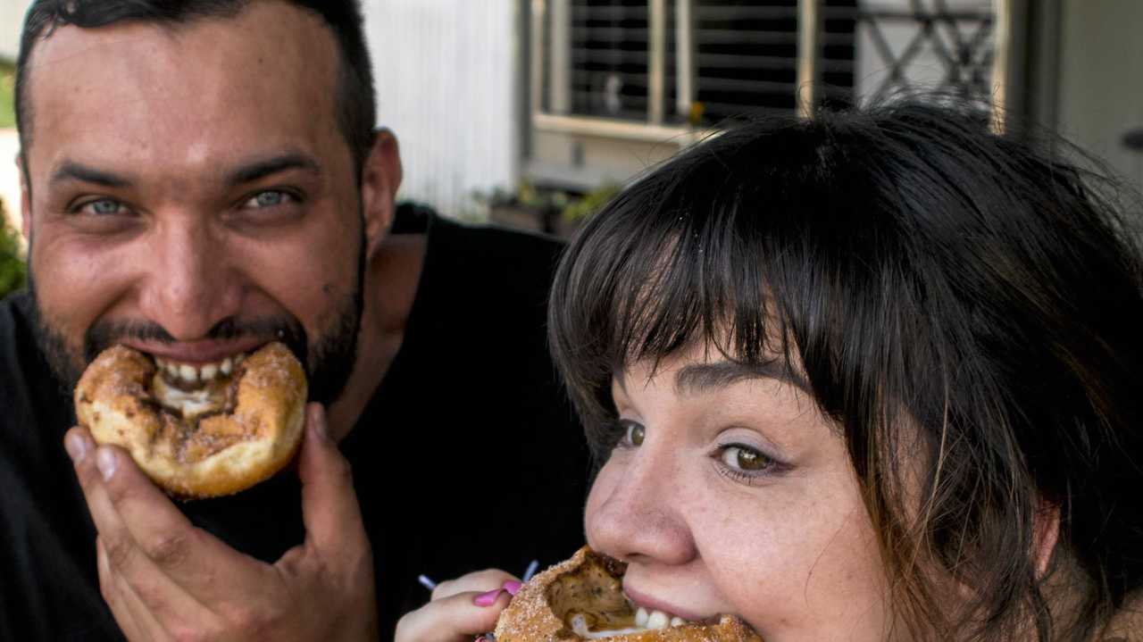 Fernando Santi and Jenna Sanders with the coffee donut. Picture: Kenilworth Bakery