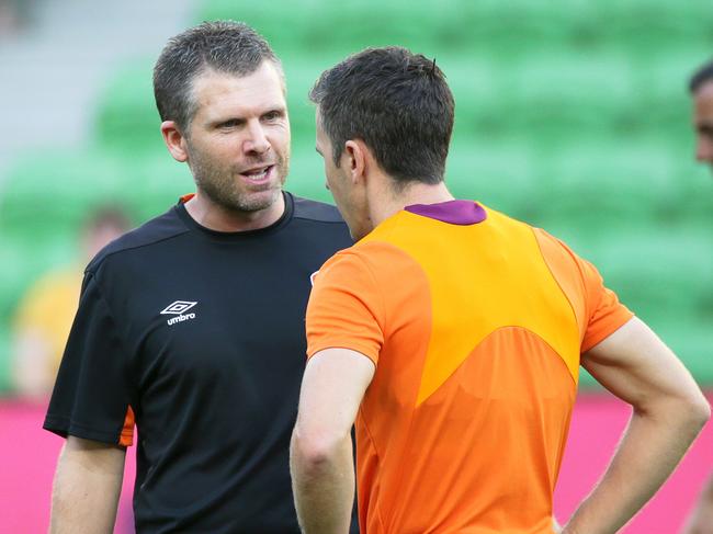 Brisbane Roar coach Darren Davies speaks with Matt McKay of Brisbane Roar during the Round 13 A-League match between Melbourne City and Brisbane Roar at AAMI Park in Melbourne, Friday, January 11, 2019. (AAP Image/George Salpigtidis) NO ARCHIVING, EDITORIAL USE ONLY