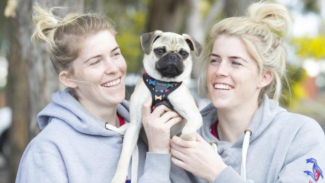 Love me love my pug ... twins Kirsten Chapman and Makaela Potts with Leo who enjoyed hanging out with his pug mates.