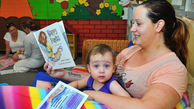 Melissa Brunet with daughter Grace 16mths reads some supportive literature to help with post-natal depression.