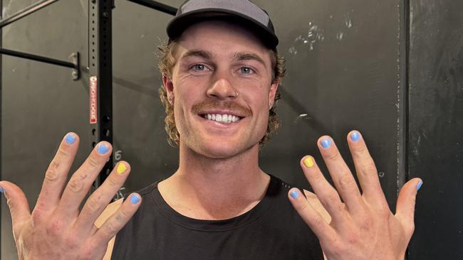 Matt LaFontaine shows off his colouful fingernails.