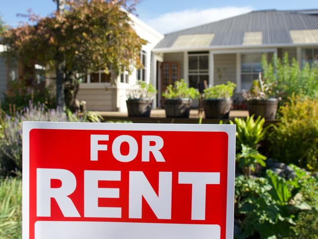 A For Rent Sign Outside a House.