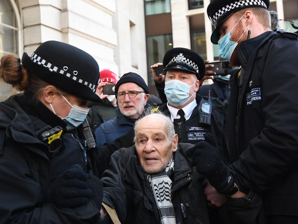 Police arrest a supporter of WikiLeaks founder Julian Assange. Picture: AFP