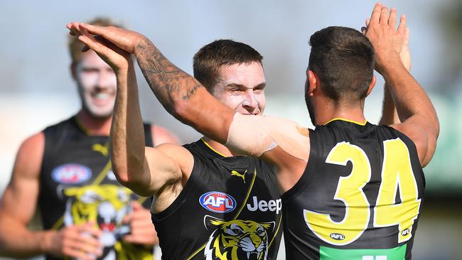 Jayden Short celebrates a goal with team-mate Jack Graham.