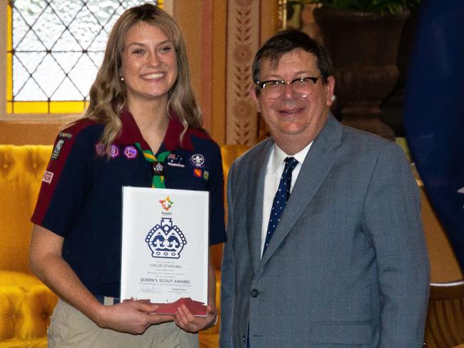 Asquith scout Chloe Starling receiving her Queen’s Scout Award from the Honourable AS Bell, at Government House on Saturday 3rd September.