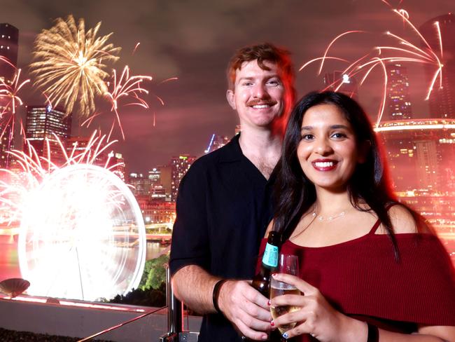 L to R, Jack Bygott with Chaashya Fernando from Deagon, spending New Years Evening at Rydges Hotel watching the Fireworks, South Brisbane  - on Tuesday 31st December 2024 - Photo Steve Pohlner