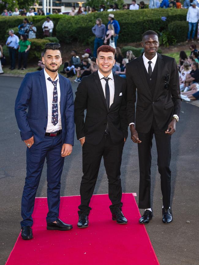 At Harristown State High School formal are (from left) Nizar Adi, Saher Khidir and Liai Liai at Highfields Cultural Centre, Friday, November 18, 2022. Picture: Kevin Farmer