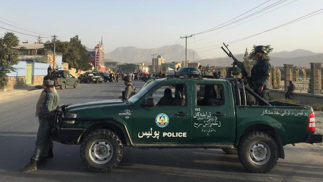 Afghan security personnel stand guard at a road block after an explosion near the Afghan cricket stadium in Kabul. PIcture: AFP PHOTO / Wakil KOHSAR