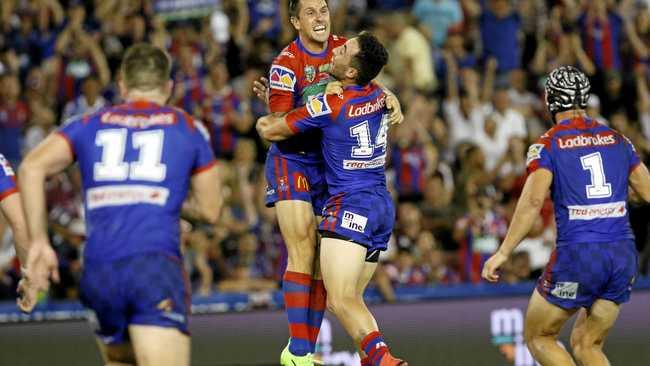 GLORY, GLORY: Newcastle Knights halfback Mitchell Pearce celebrates after kicking the winning field goal. Picture: DARREN PATEMAN