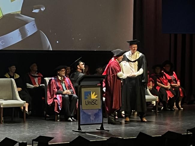 Graduates from the University of the Sunshine Coast's Fraser Coast campus celebrating at the Brolga Theatre.