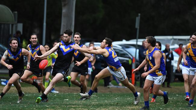 Old Carey’s Kristian Jaksch gets his kick away against Beaumaris on Saturday. Picture: James Ross