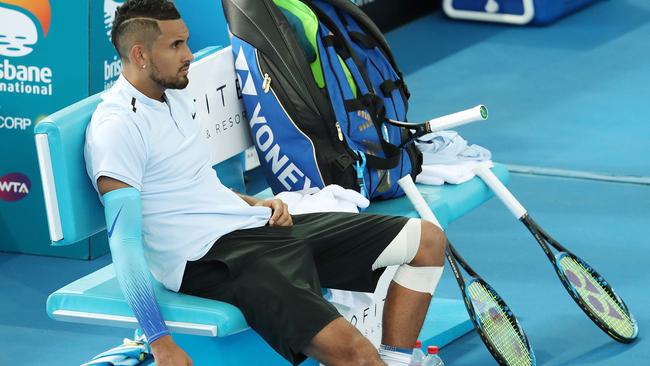 Nick Kyrgios plays on and wins with a bandage on this left knee. Nick Kyrgios vs. Matthew Ebden, Brisbane International Tennis, Pat Rafter Arena, Tennyson. Photographer: Liam Kidston