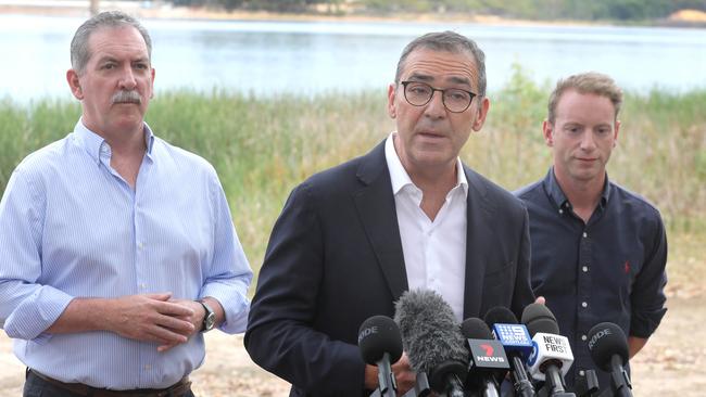 Premier Steven Marshall, centre, Environment Minister, David Speirs, and local Liberal MP, Steve Murray, at the Happy Valley Reservoir on the election campaign trail. Picture Dean Martin