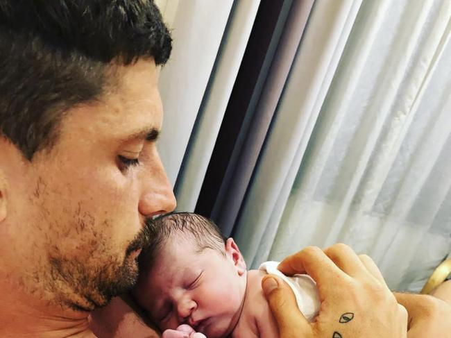 February 2020: Western Bulldogs footballer Tom Liberatore with his new-born son, Oscar.