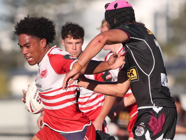 Langer Trophy game between PBC (red and white) and Marsden at Tugun .PBC's Barney Litidamu breaks through the Marsden line. . Picture Glenn Hampson