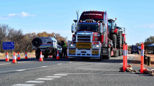 Police check vehicles at the NT/SA border. Coronavirus restrictions are set to be eased in the Northern Territory this week. Here’s what we know so far. Picture: Chloe Erlich