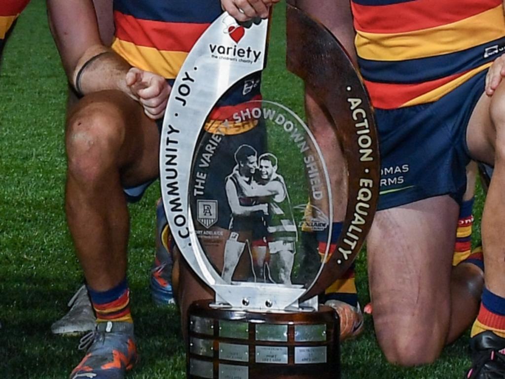 ADELAIDE, AUSTRALIA – JULY 29: The Crows pose with the Variety Showdown Shield after winning the round 20 AFL match between Adelaide Crows and Port Adelaide Power at Adelaide Oval, on July 29, 2023, in Adelaide, Australia. (Photo by Mark Brake/Getty Images)