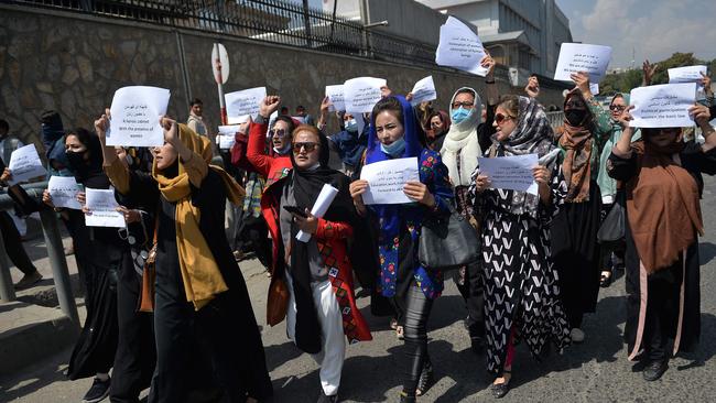 Afghan women take part in a protest march for their rights under the Taliban rule in the downtown area of Kabul.