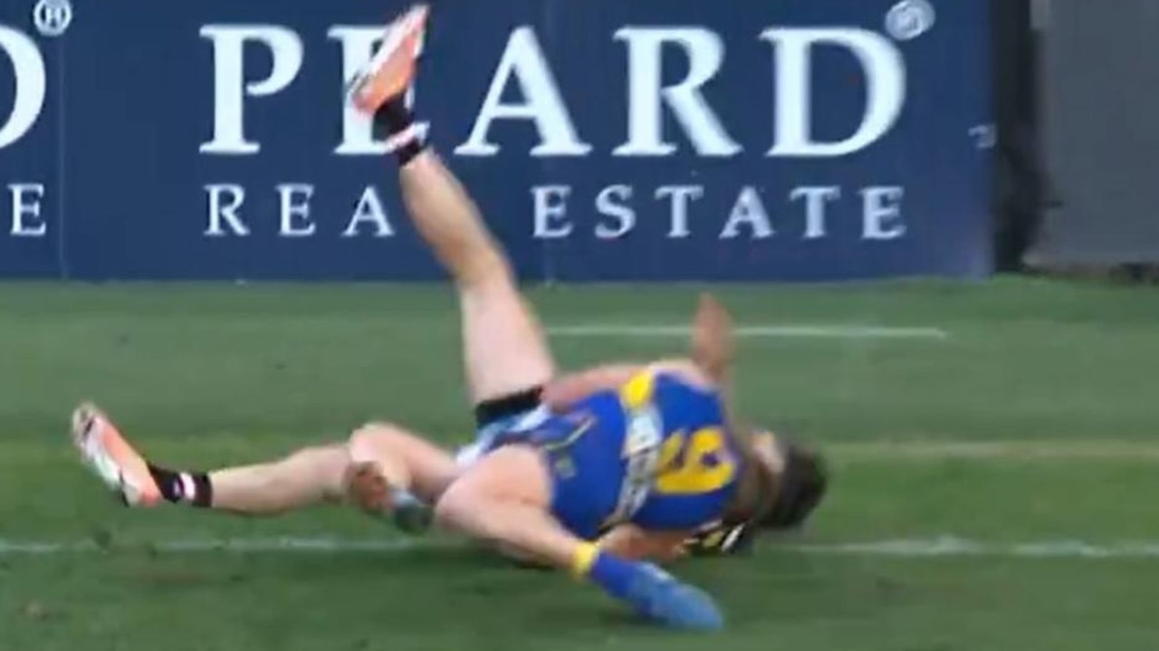 Reid dumps Wilson as his head slams into the turf. Credit: Fox Footy