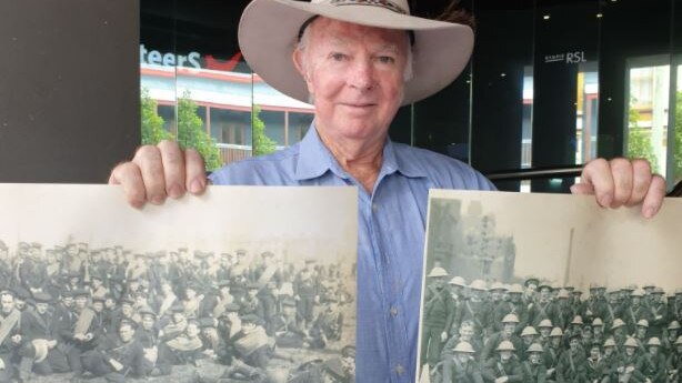 HONOUR: Vietnam veteran Ray Hiddlestone with photographs of WW1 troops from his father's war album that he is donating to Gympie RSL. Photo: Frances Klein