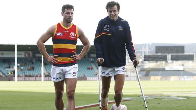 Will Hamill is seen on crutches post-match.