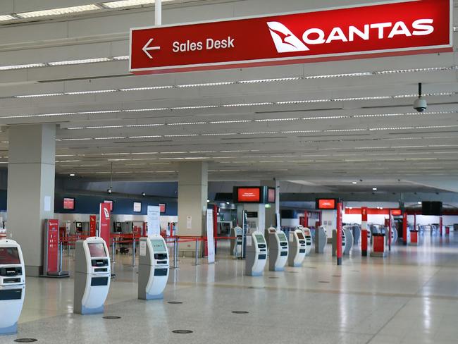 A general view shows the empty Qantas departure terminal at Melbourne Airport on August 20, 2020. - Australian flag carrier Qantas on August 20, 2020 posted an almost 2 billion USD annual loss after a "near-total collapse" in demand due to the COVID-19 coronavirus pandemic. (Photo by William WEST / AFP)