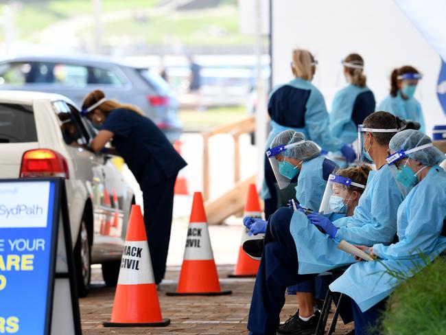 SYDNEY, AUSTRALIA - NCA NewsWire Photos JANUARY, 09, 2021: NSW Health workers dressed in Personal Protection Equipment (PPE) are seen waiting for patients at the St Vincent's Hospital drive through COVID-19 testing clinic at Bondi Beach, in Sydney. The Northern Beaches of Sydney. Picture: NCA NewsWire/Bianca De Marchi