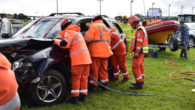 The SES Rescue team take apart a car at the Warrnambool Show.