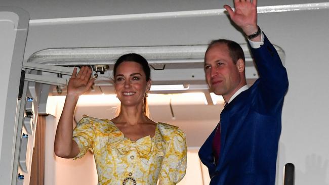 William and Kate wave from their aircraft as the leave Nassau. Picture: Getty Images.