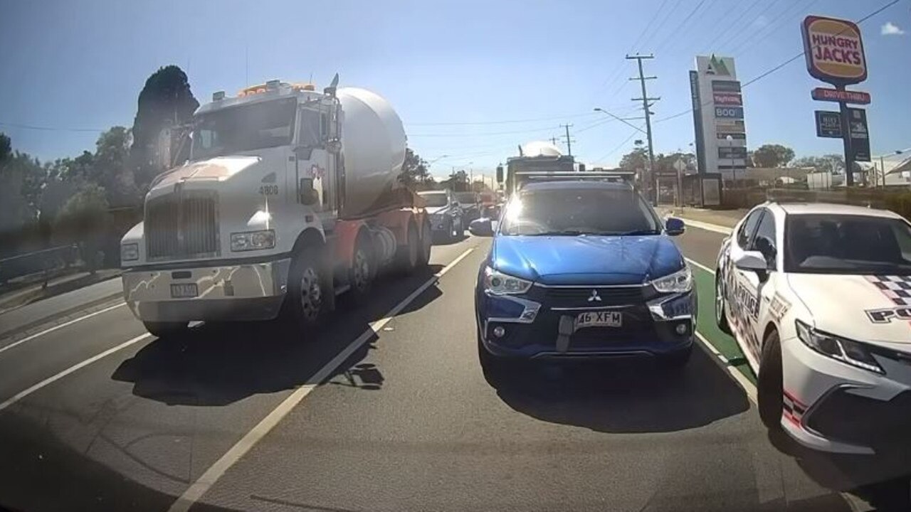 The police car pulled up beside the allegedly stolen vehicle in traffic, after which one officer exited the vehicle and approached the car. Picture: Facebook