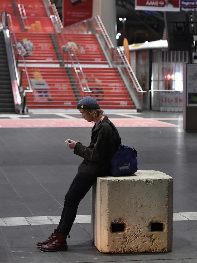 A man rests on a bollard. Picture: Nicole Garmston