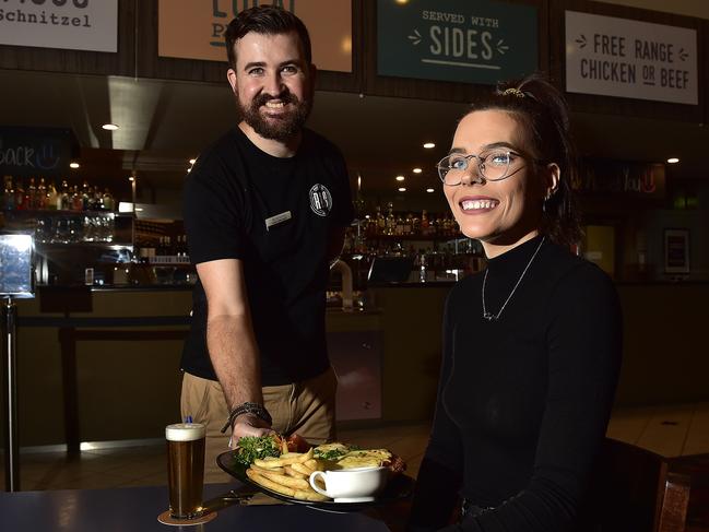 Venue manager Anthony Robertson serves a pub meal to Kayley Crich as Covid-19 restrictions begin to lift. Tom's Tavern has reopened for pub meals. PICTURE: MATT TAYLOR.