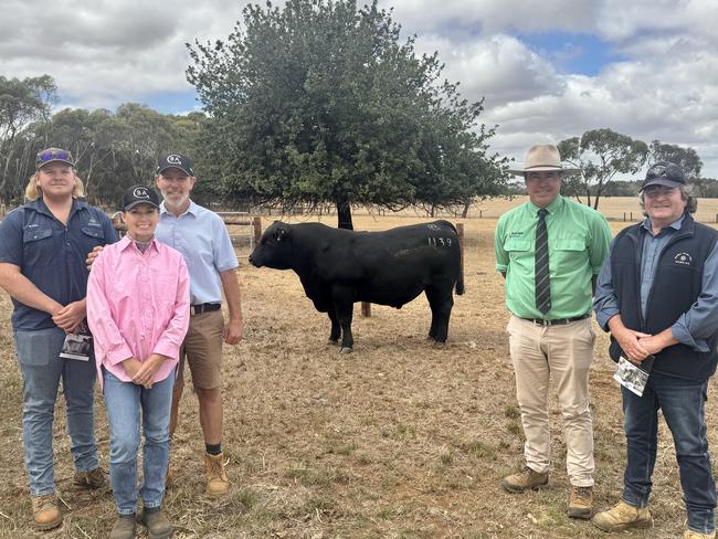 Buying the top priced, $28,000, bull at the Glatz's sale today at Branxholme was the McBride Operations, Telopea Downs, represented by livestock overseer Jye Doig, far left, and general manager Drew Maxwell, far right. Also pictured are Samantha and Ben Glatz, and auctioneer Richie Miller. Pictures: Kate Dowler.