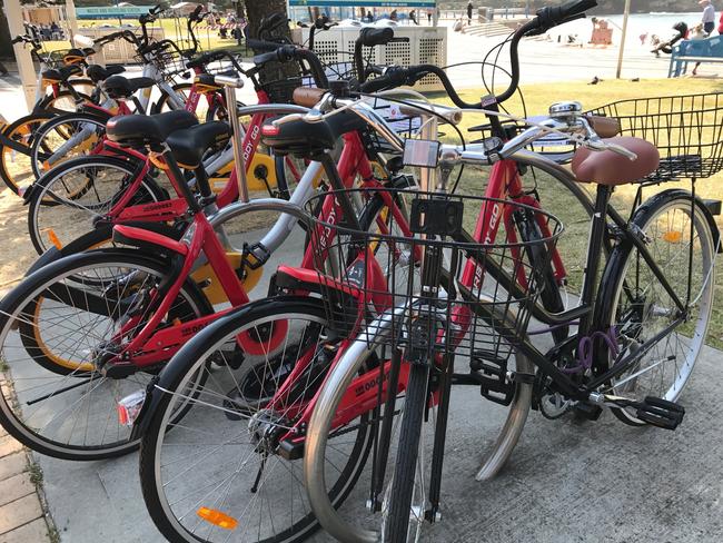 Hire bikes operated by Reddy Go and oBike are piling up at Coogee where 81 abandoned bicycles were counted in one day. Picture: Rebecca Franks