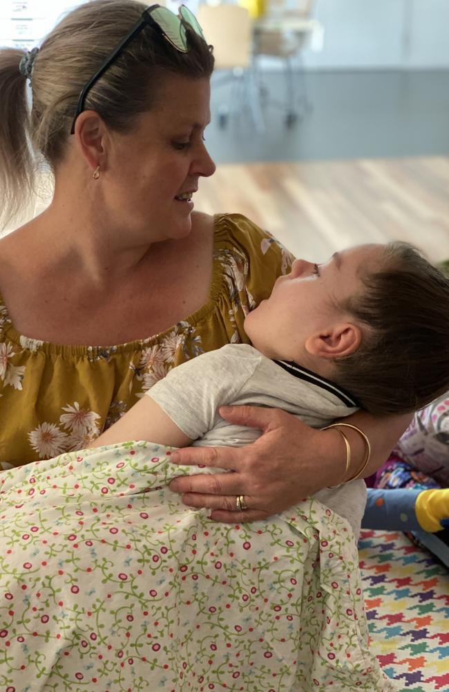 Close family friend and godmother Sue Wynn holds Indie Fitzgerald.