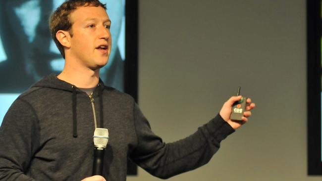 Facebook CEO Mark Zuckerberg answers questions during a media event at Facebook's headquarters in Menlo Park, California on March 7, 2013. Facebook on Thursday began transforming the stream of updates from friends at home pages into a "personalized newspaper" with news ranging from the personal to the global. The News Feed on home pages at the leading social network was revamped to get rid of clutter and present "bright, beautiful" stories whether they are insights from friends or trending news of the day. AFP PHOTO /Josh EDELSON