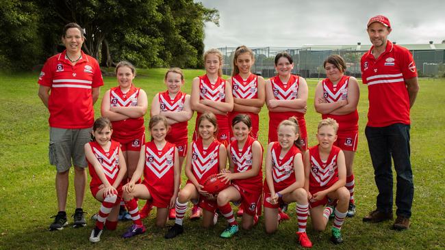 WONDER WOMEN: The coaches and the Lismore Swans Junior Australian Football Club young women playing in the Girls U11.5 team.