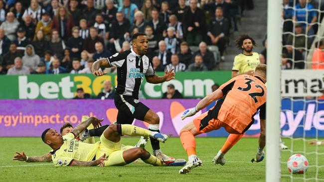 Callum Wilson of Newcastle United forces the error. (Photo by Stu Forster/Getty Images)