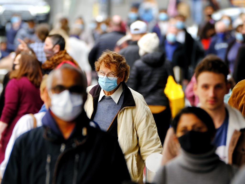 Victorians must continue wearing masks in all indoor and outdoor settings in a bid to keep the community free of the virus. Picture: NCA NewsWire / Luis Enrique Ascui