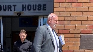 Stephen Gregory Hancock (left) leaving Belmont Local Court with solicitor Iain Bruce on Wednesday. Picture Amy Ziniak