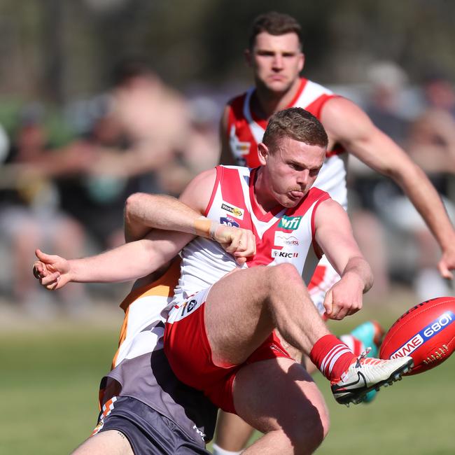 Ararat’s Robert Armstrong just gets his kick away.